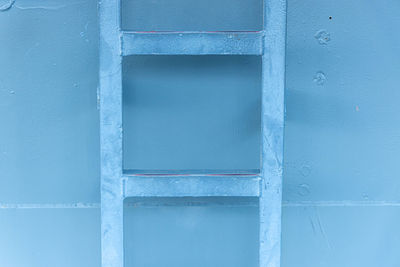 Full frame shot of blue window on wall