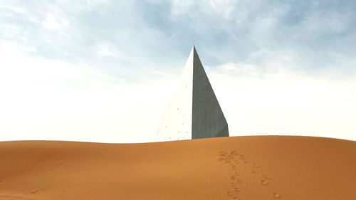 Low angle view of desert against sky during sunset