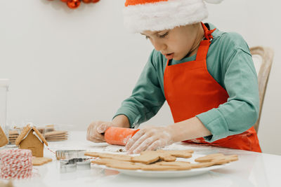 Midsection of woman preparing food on table