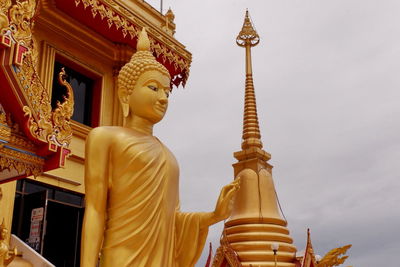 Low angle view of statue against building