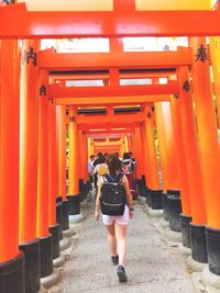 Rear view of women walking in temple