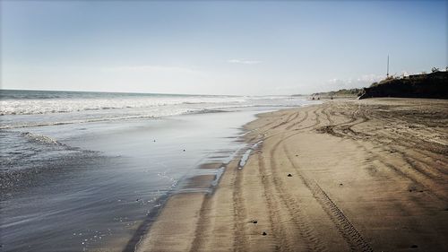 Scenic view of beach against sky