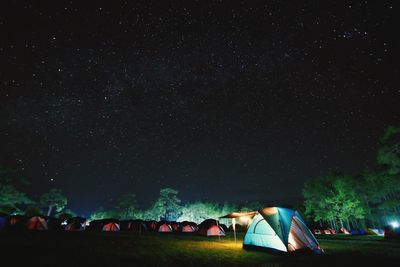 Tent on field against sky at night