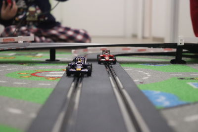 Close-up of toy cars on track