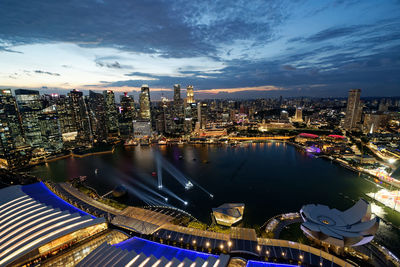 High angle view of illuminated buildings against sky at night