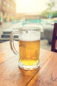 Close-up of beer glass on table