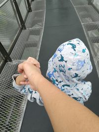 Close-up of hand holding a child hand