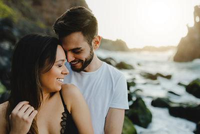 Young couple kissing in water