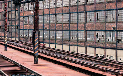 Railroad tracks against building