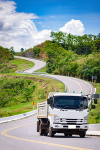 Cars on road against sky