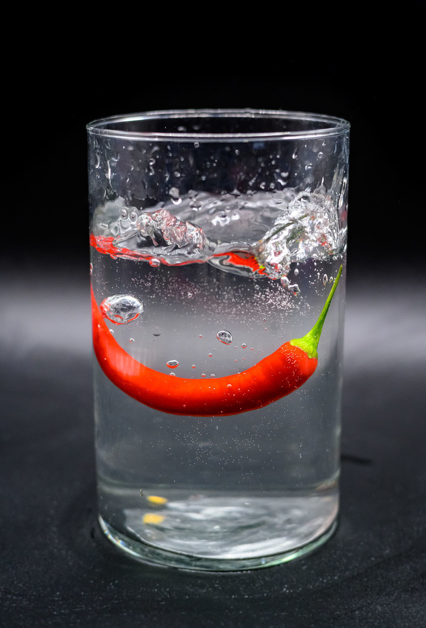CLOSE-UP OF DRINK ON GLASS