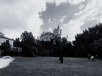 Panoramic view of trees and buildings against sky