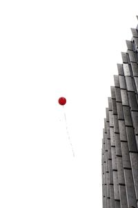 Low angle view of balloons against sky