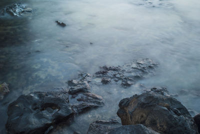 High angle view of rocks in water