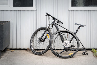 Bicycle leaning against wall