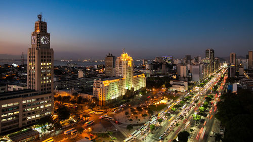 High angle view of city lit up at night