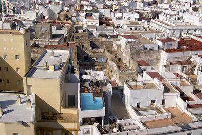 High angle view of buildings with private swimming pool in town