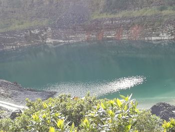 Scenic view of calm lake against mountain