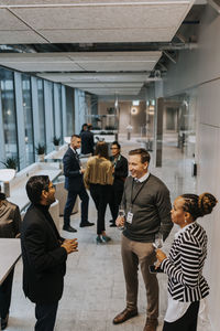 Multiracial professionals discussing during networking conference