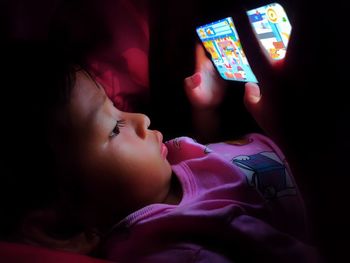 Midsection of child using mobile phone