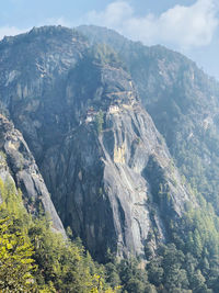 Aerial view of land and mountains against sky