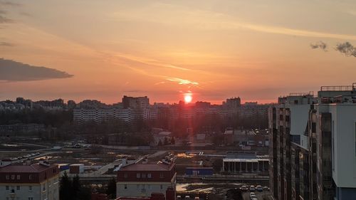 High angle view of buildings against sky during sunset