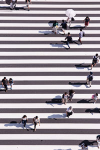 High angle view of people crossing on road