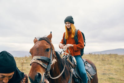 Friends riding horse