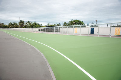 Scenic view of soccer field against sky