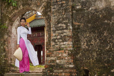 Beautiful woman exploring the imperial palace in hue / vietnam