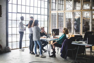 Computer professionals planning new business strategies in creative office