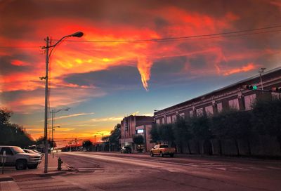 Street against sky at sunset