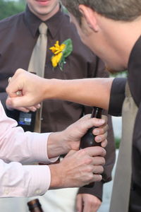 Cropped image of man hands and a beer bottle