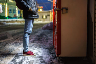 Low section of man standing on floor