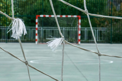Close-up of rope tied to bollard