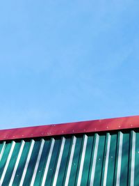 Low angle view of building against clear blue sky