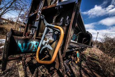 Low angle view of abandoned train against the sky