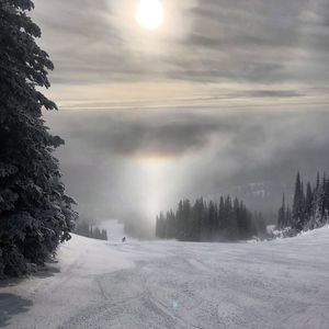 Scenic view of snow covered landscape against sky