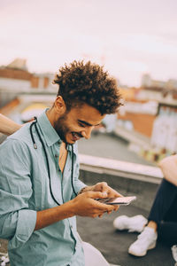 Young man using mobile phone