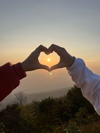 Low section of man holding hands