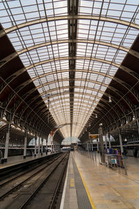 Inside large london train station glass and steel roof
