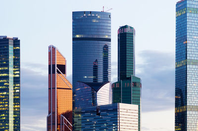 Modern buildings in city against sky