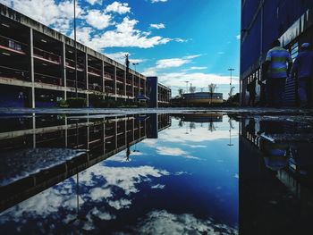 Reflection of building in puddle