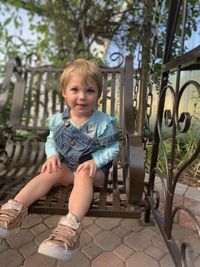 Young girl sitting on  swing  chair