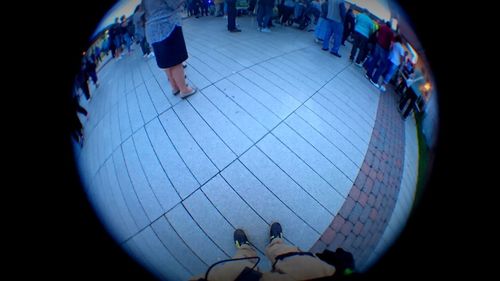 High angle view of people standing in illuminated corridor