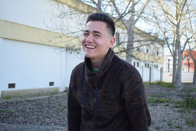 Portrait of young man standing outdoors