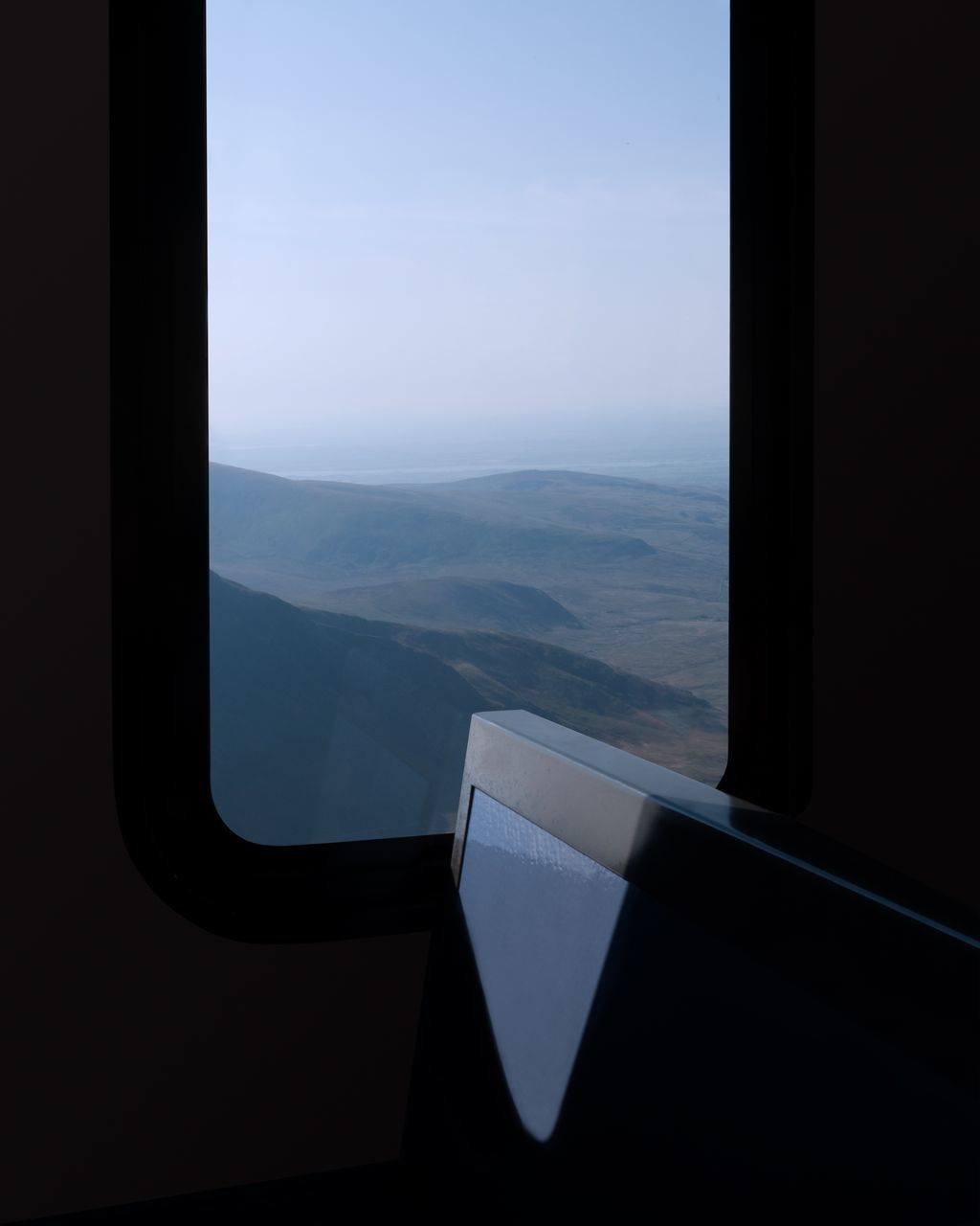 window, air vehicle, airplane, glass - material, mode of transportation, transportation, scenics - nature, transparent, sky, vehicle interior, no people, travel, beauty in nature, day, nature, landscape, flying, indoors, public transportation