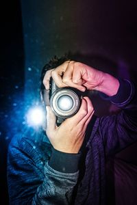 Close-up of man holding camera