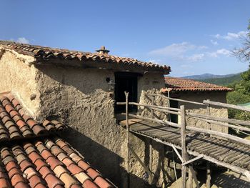 Exterior of old building against blue sky