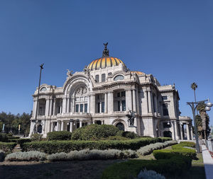 Low angle view of building against clear blue sky